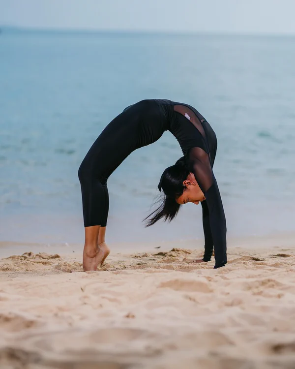 Bridge pose on the beach